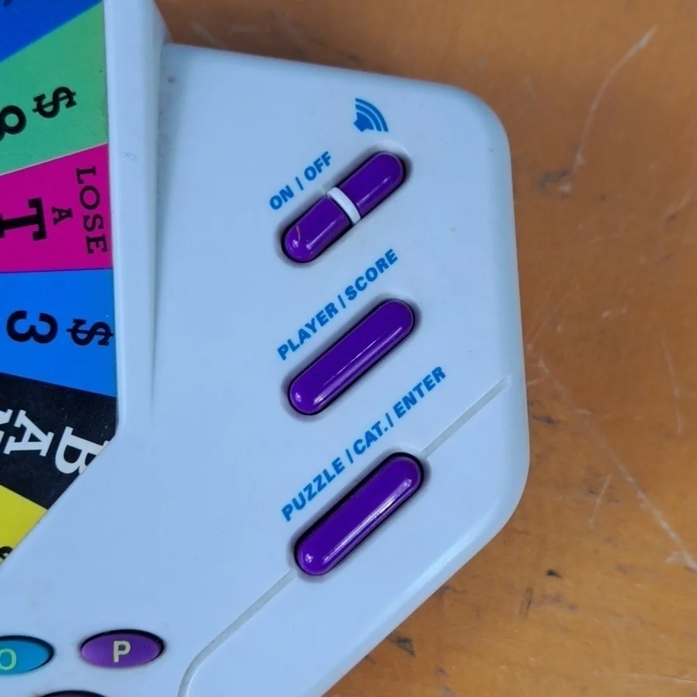 Vintage 1999 Tiger Wheel of Fortune hand held electronic game show game Tested